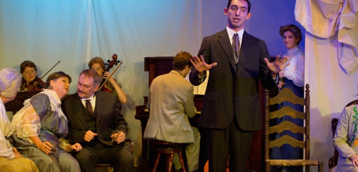 From Mad Cow Theatre's "James Joyces' The Dead" -- Blake Aburn as Michael, Nicholas Wuehrmann as Gabriel Conroy, Karel Wright as Aunt Kate Morkan, Patti McGuire as Aunt Julia Morkan, musicians Jacquelyn Cunningham, Lindsey Gradwohl, and Philip King with Rachel Jones as Rita in background. Photo by Tom Hurst Photography