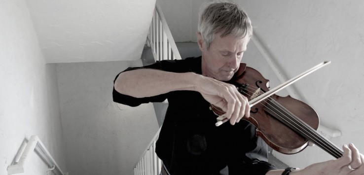 Violist John Harbaugh rehearses for Brevard Community Chorus Holiday Concert. Photo by Pam Harbaugh